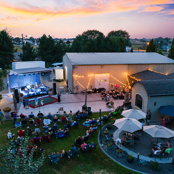 Outdoor concert with audience at sunset