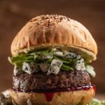 Gourmet burger with blue cheese and greens