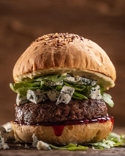 Gourmet burger with blue cheese and greens