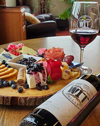 Blueberry-Chutney-400x500-1 Wine and cheese platter with assorted fruits and snacks.