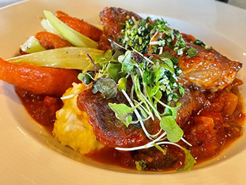 Gourmet chicken dish with vegetables and herbs