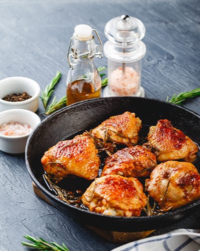 Roasted chicken thighs in cast iron skillet