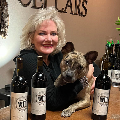 Woman with dog at wine counter