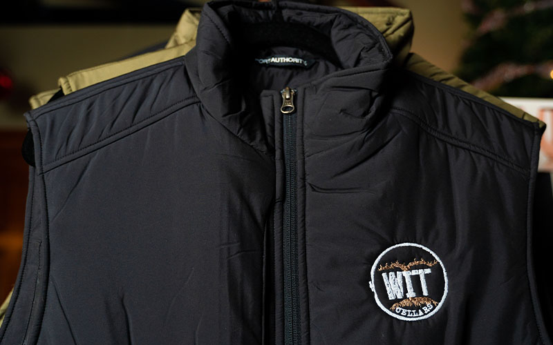 WIT Merch_0013_WIT_Product Lifestyle Shoot_11.23.2021-02548 Black vest with embroidered WW logo.