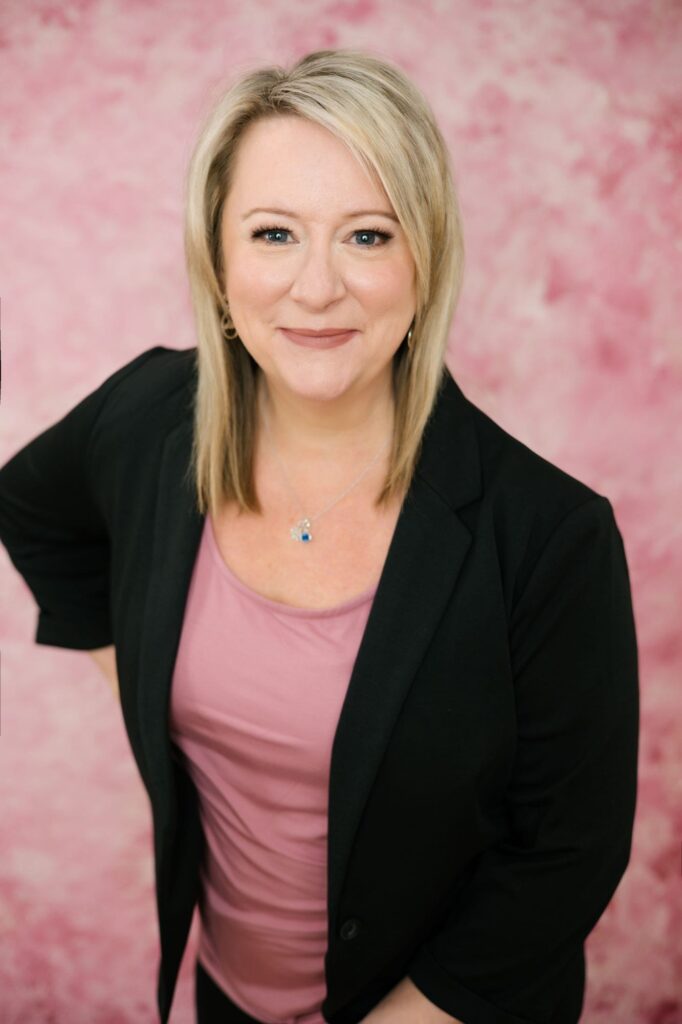 AngieH-Speaker Smiling woman with pink background