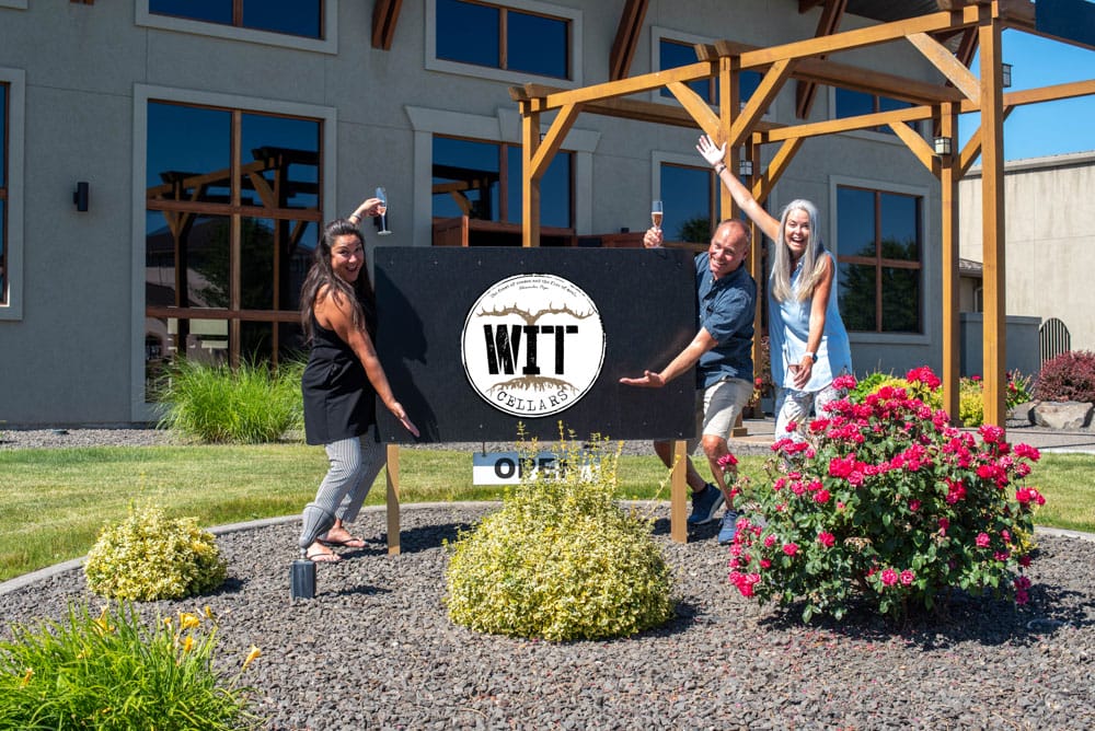 People celebrating outside WIT Cellars winery.