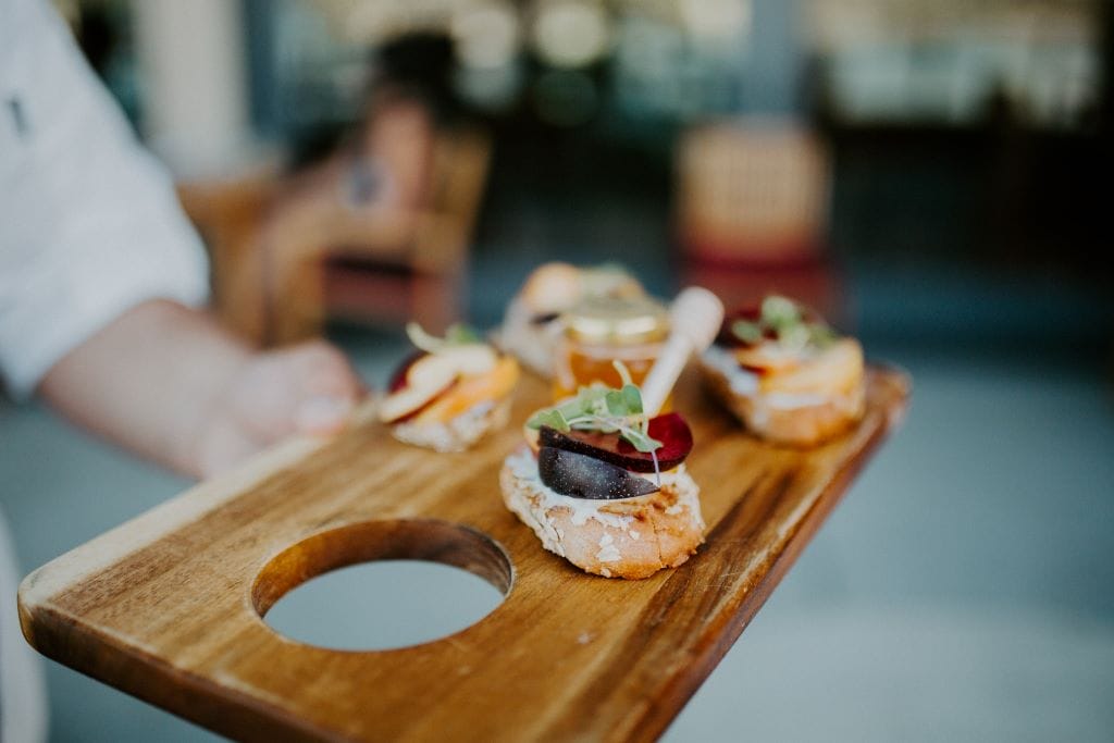 Drumhellers-dinner-2023 Appetizers on wooden board with microgreens