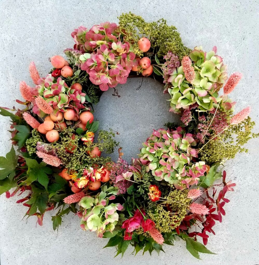 Fall-wreath Colorful floral wreath with pink and green flowers.