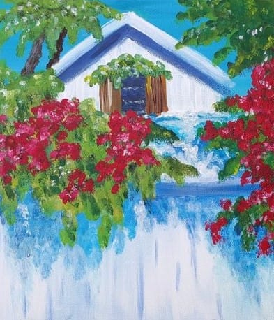 Colorful house surrounded by vibrant flowers and greenery.