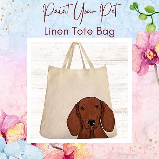 Linen tote bag with dog illustration and flowers.