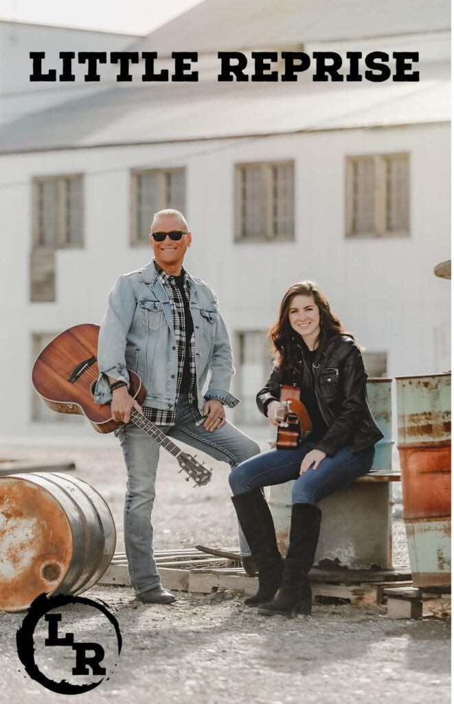 Musicians with guitars outdoors near barrels.