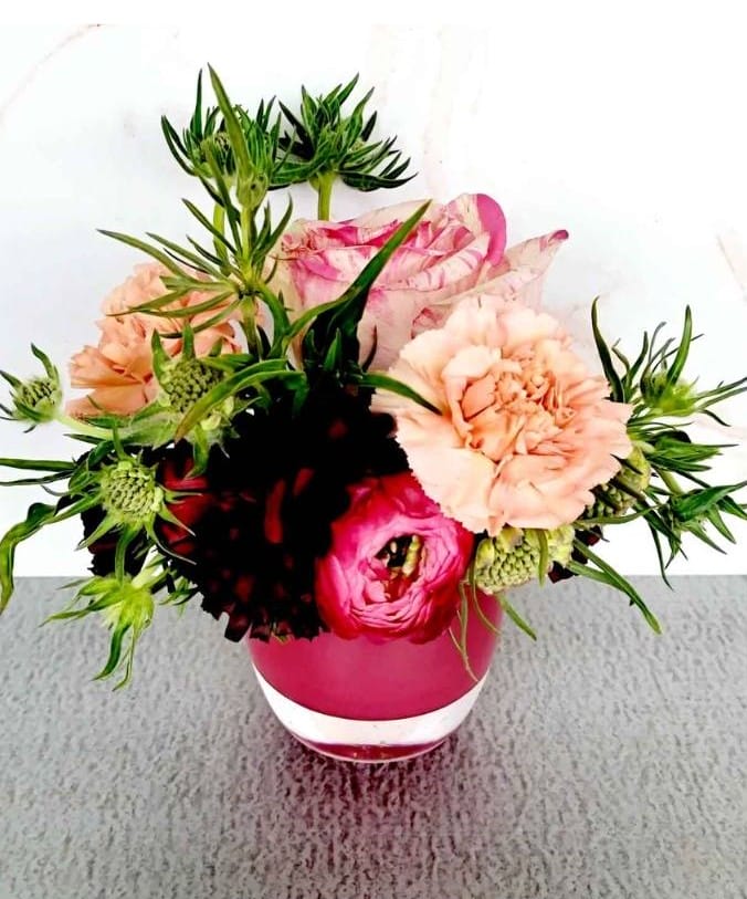 Pink and peach flowers in a vase.