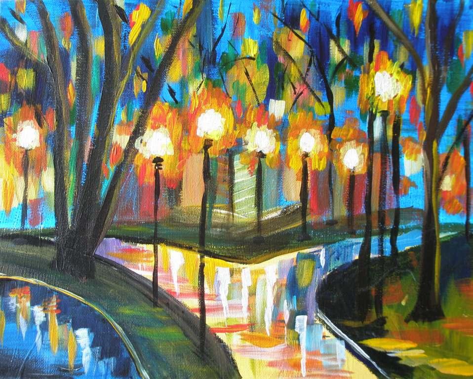 Colorful park scene with trees and streetlights at night.