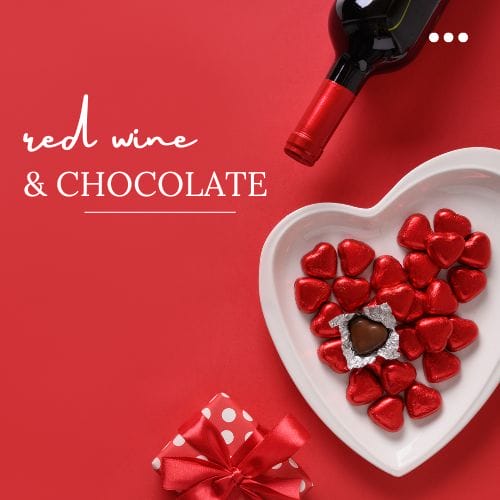 Red wine, heart chocolates, and gift box