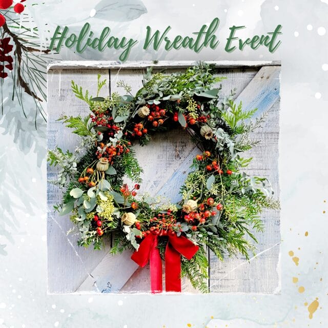 Festive holiday wreath with red ribbon