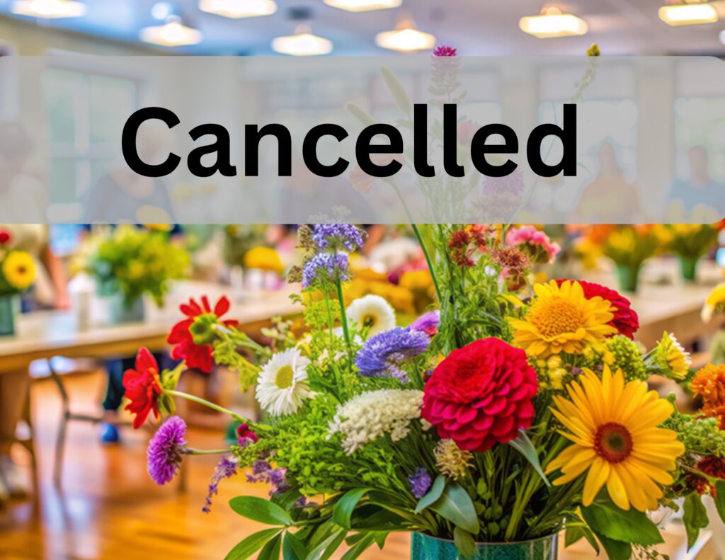 Flower event canceled sign over colorful bouquet.
