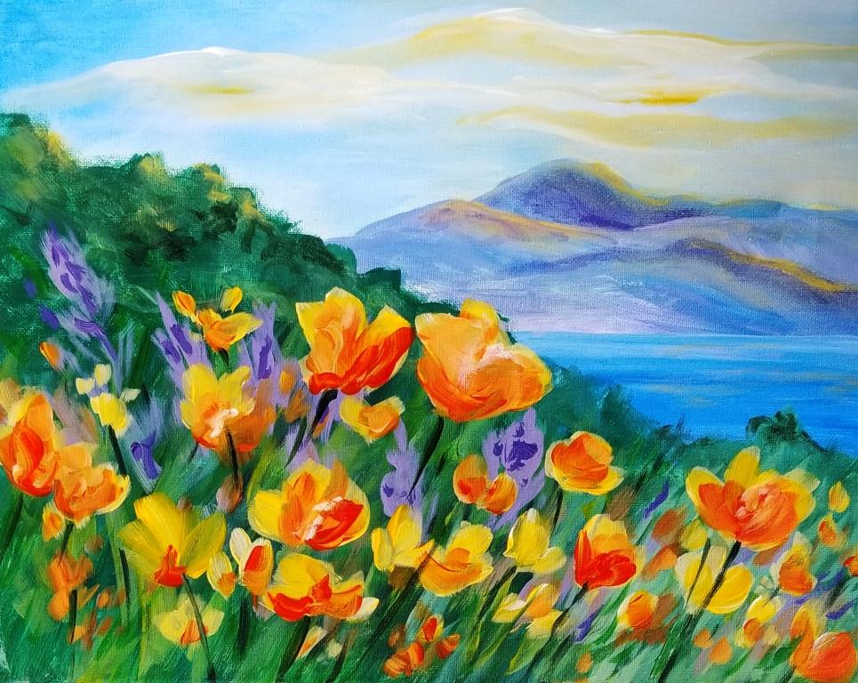 Colorful flowers by a serene mountain lake.