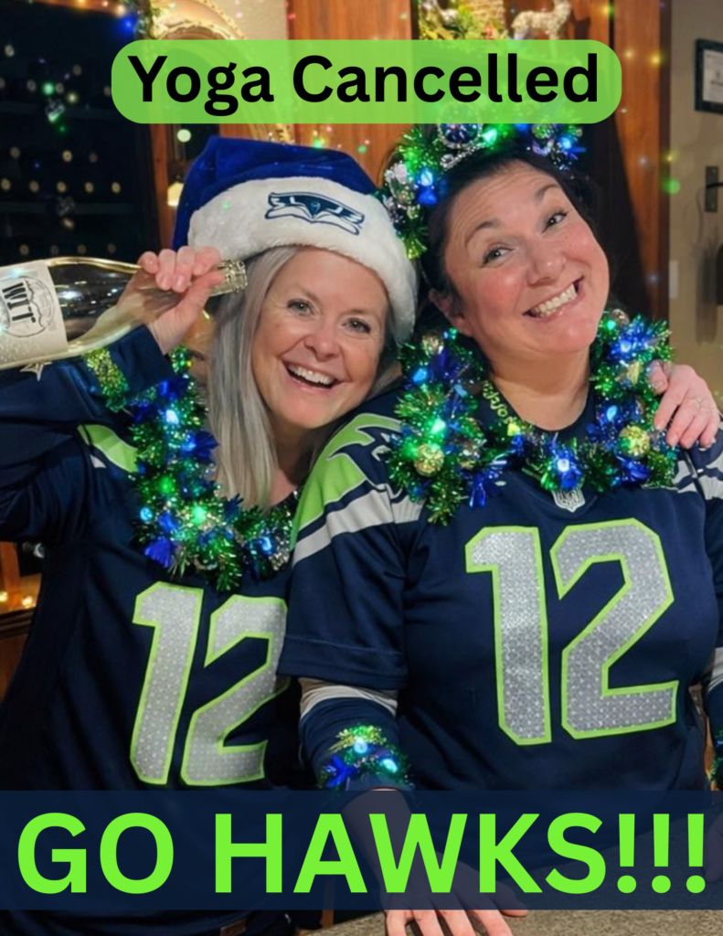 Two women celebrating in sports jerseys with decorations.