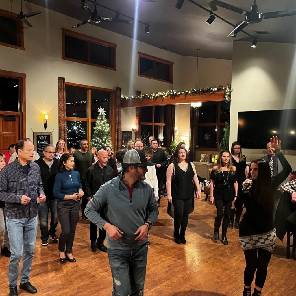 Group dancing at festive indoor holiday party