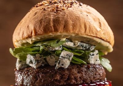 Gourmet burger with blue cheese and greens