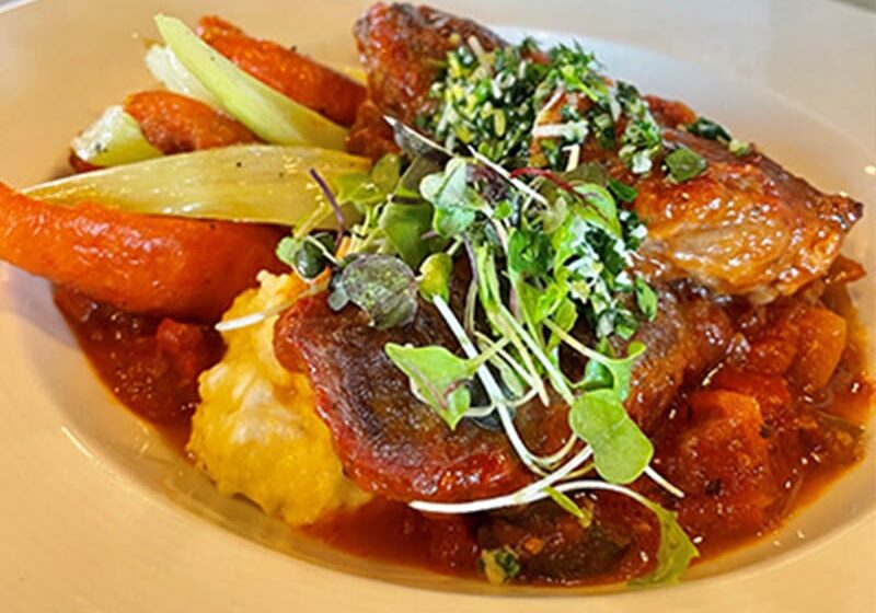 Gourmet chicken dish with vegetables and herbs