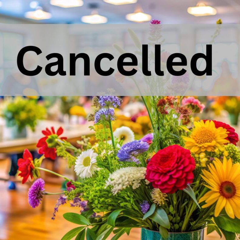Flower event canceled sign over colorful bouquet.