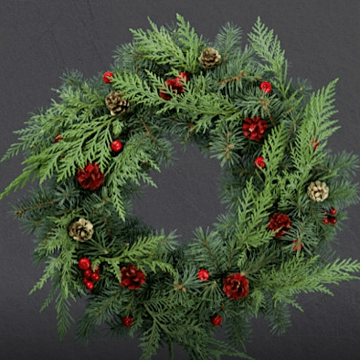 Festive wreath with pinecones and red berries